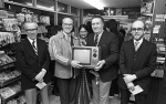 South Side News: Ex Celtic Manager Jock Stein presents a TV the winner of a competition run by the Park View Service Station in Glasgow's South Side. 14th March 1983.